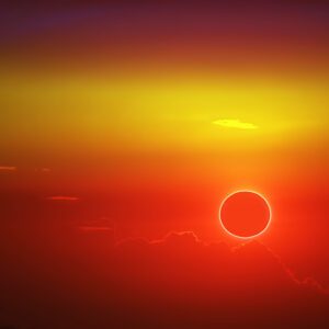 total sun eclipse over cloud sunset orange sky