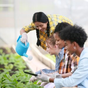 group of young diverse people enjoy activity at organic farm.